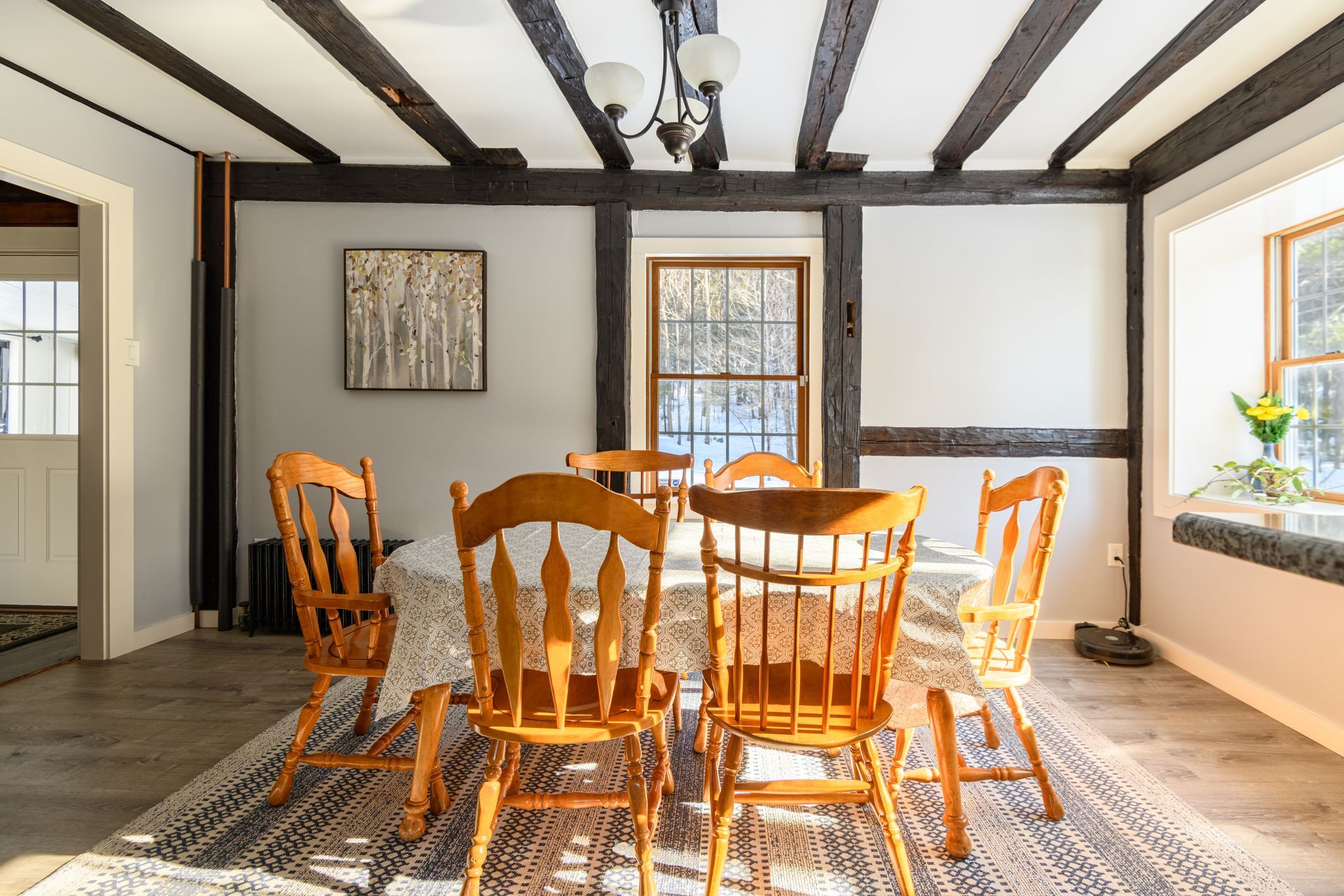 A man is swimming in the ocean surrounded by sharks.