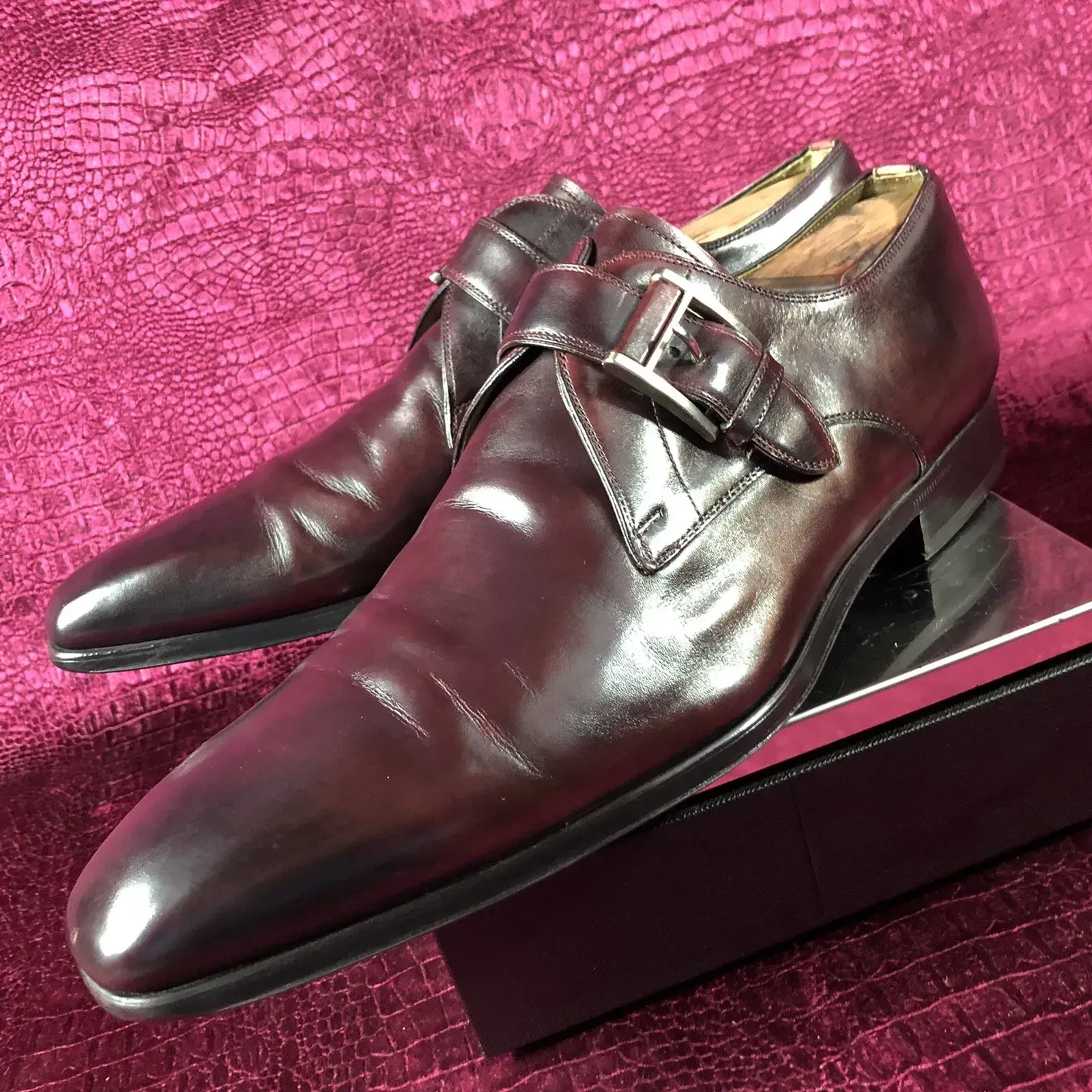 A pair of brown shoes are sitting on top of a box