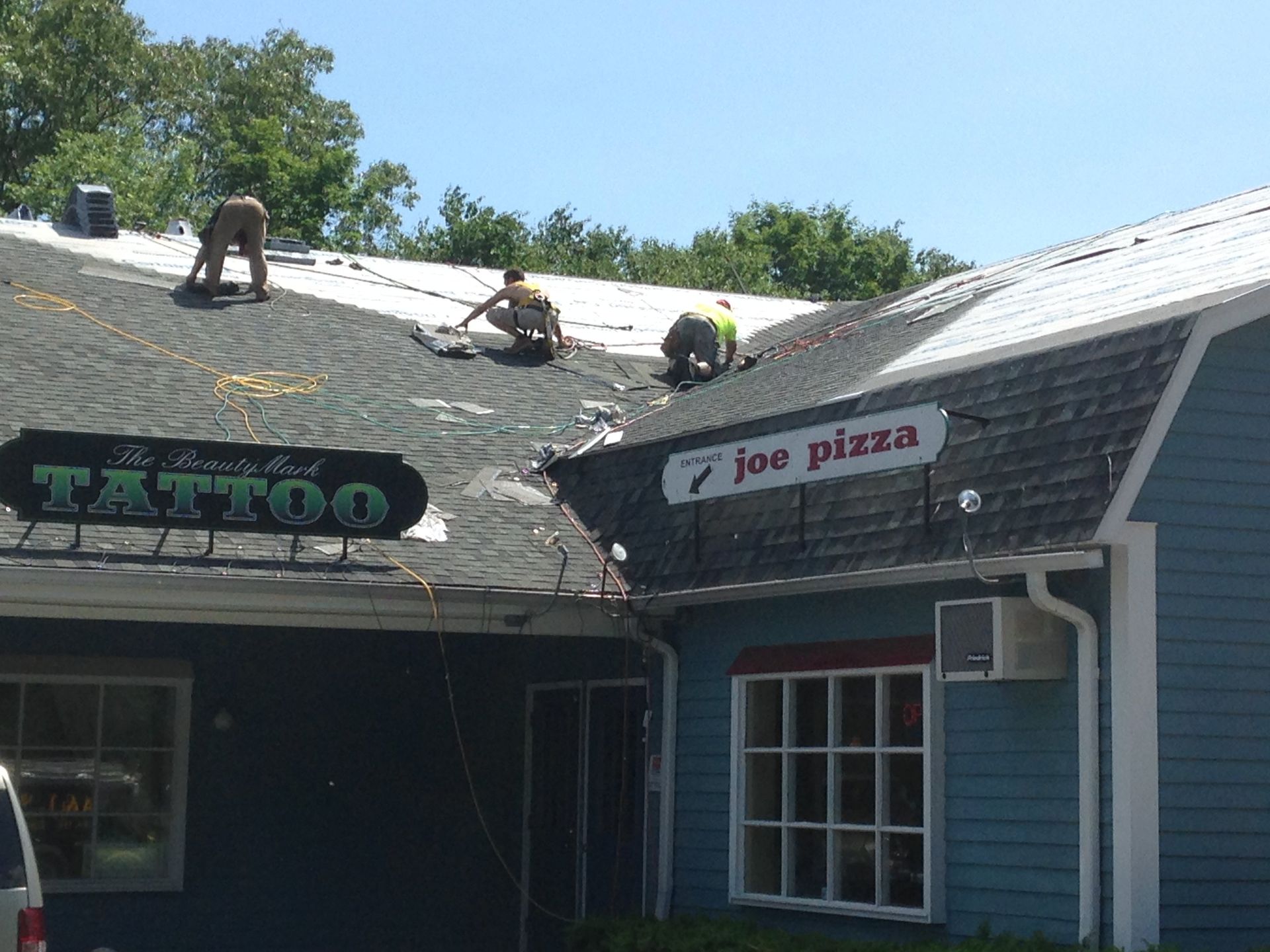 Roofing contractors on the job at New Hartford