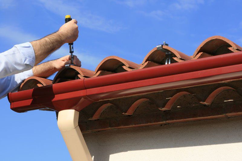 Roofing contractors on the job at New Hartford