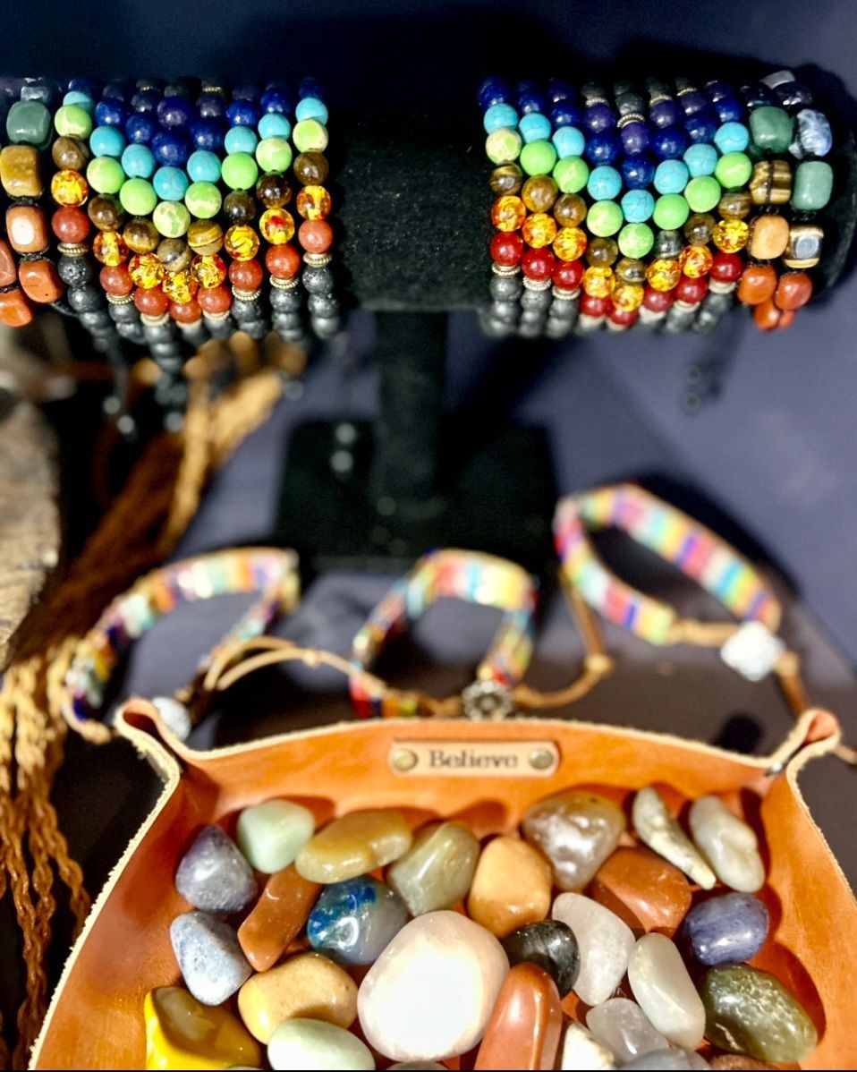 A display of bracelets and a bowl of rocks