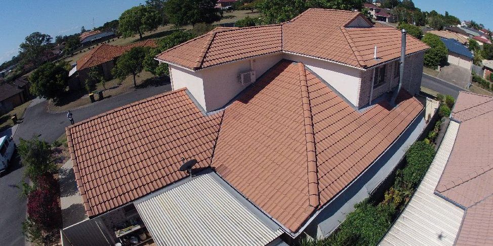 An aerial view of a house with a tiled roof