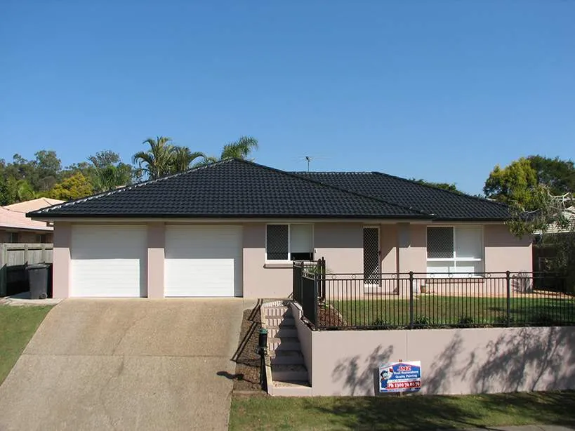 A house with a for sale sign in front of it