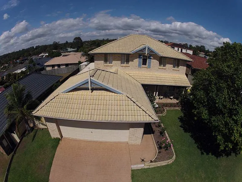 An aerial view of a house with a tiled roof
