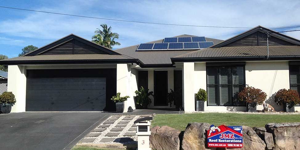 The front of a house with a sign that says ' for sale ' on it