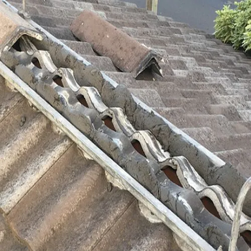 A close up of a roof with a drain on it