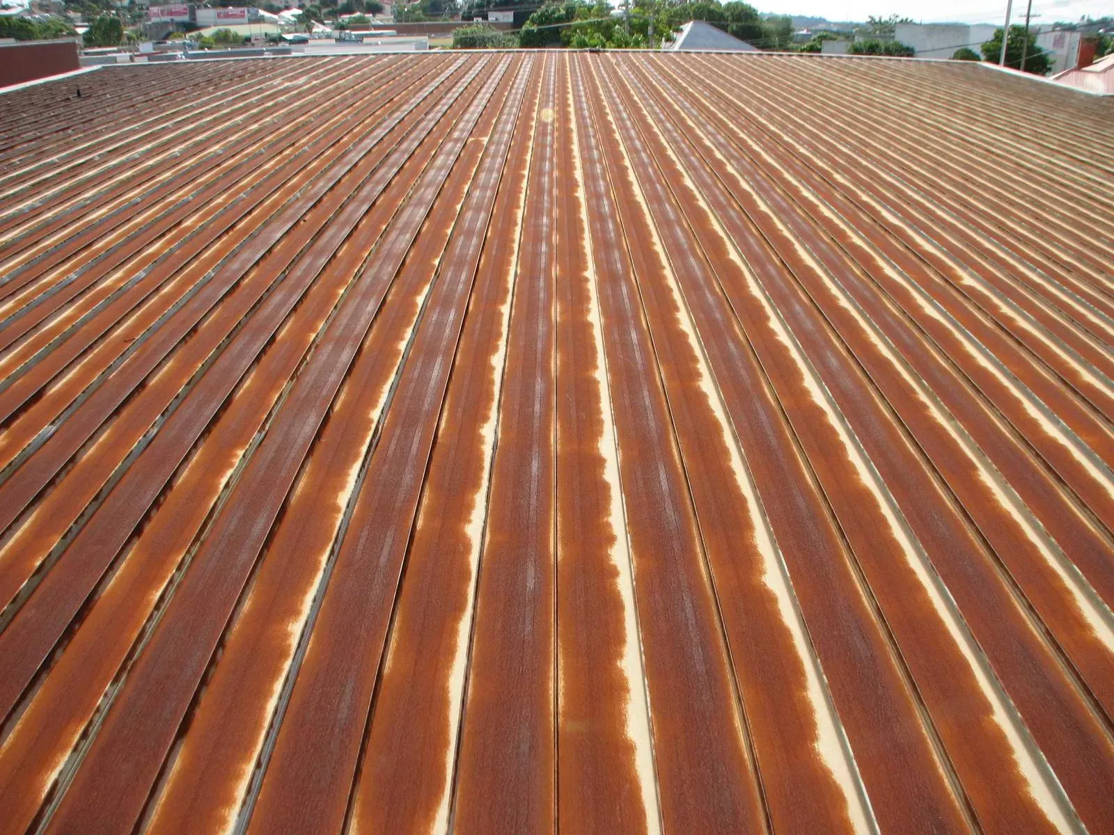 A rusty roof with a lot of lines on it
