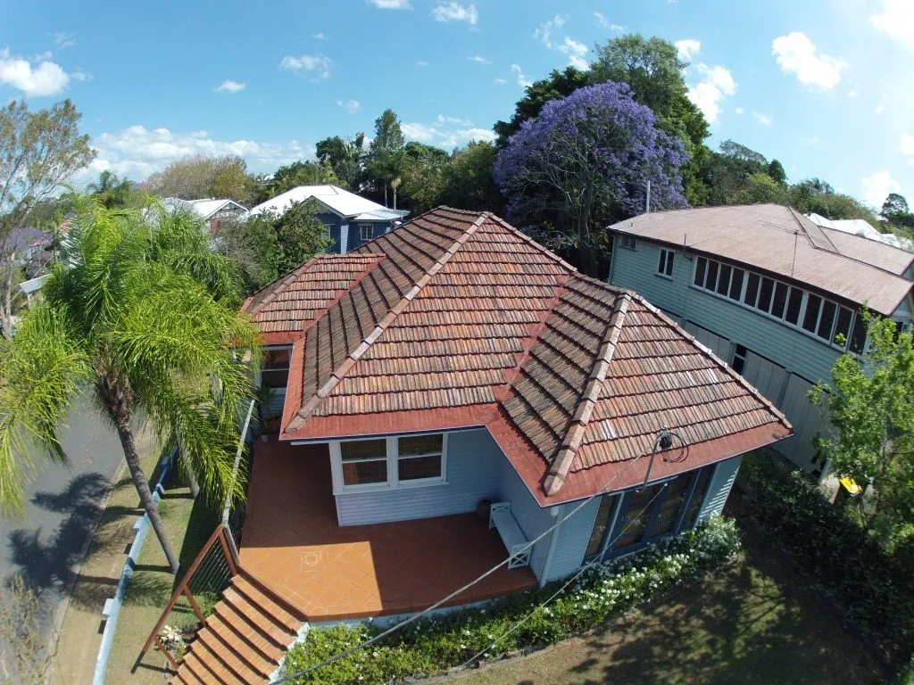 An aerial view of a house with a tiled roof