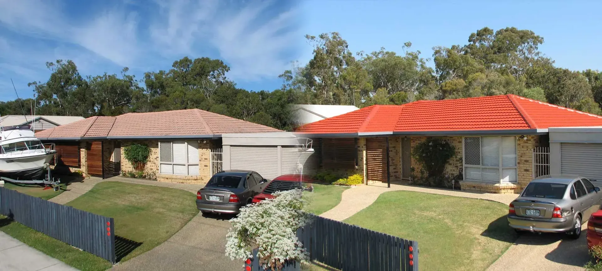 A car is parked in front of a house with a red roof