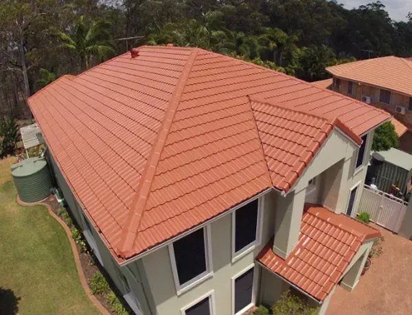 An aerial view of a house with a red tiled roof