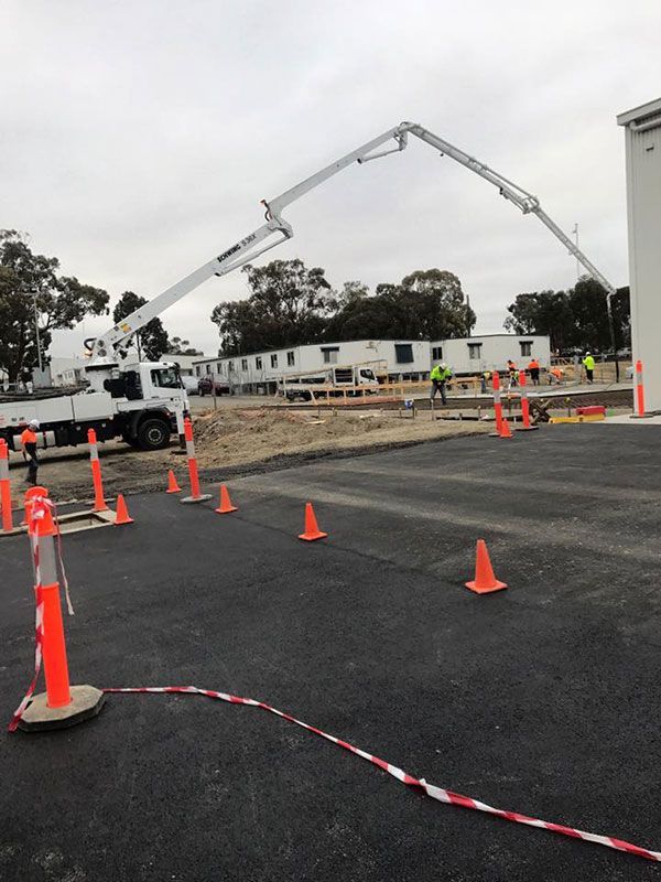 A concrete pump is being used on a construction site