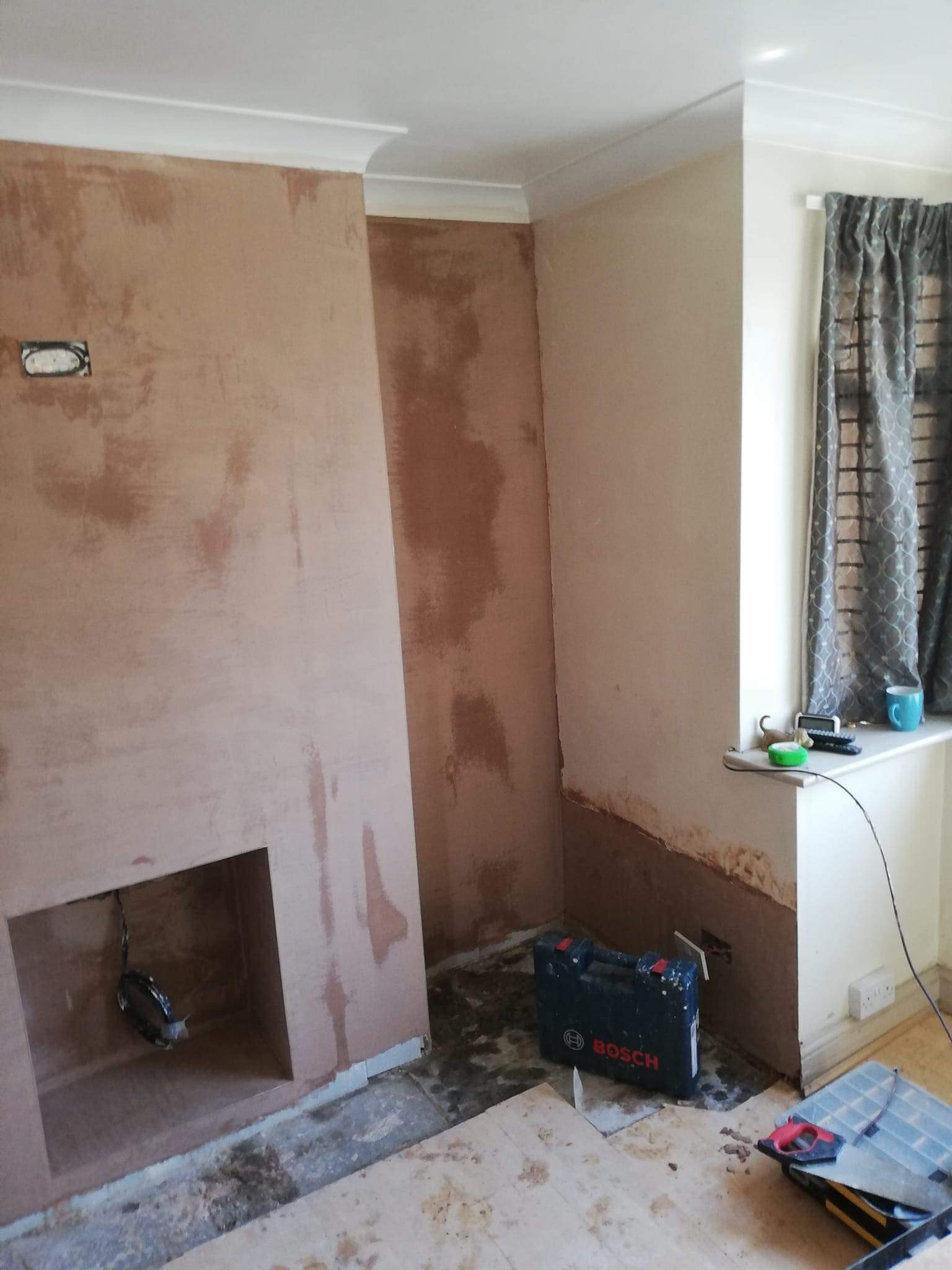 Picture of a rendered house which has been newly painted in soft yellow by Painters and Decorators Leeds