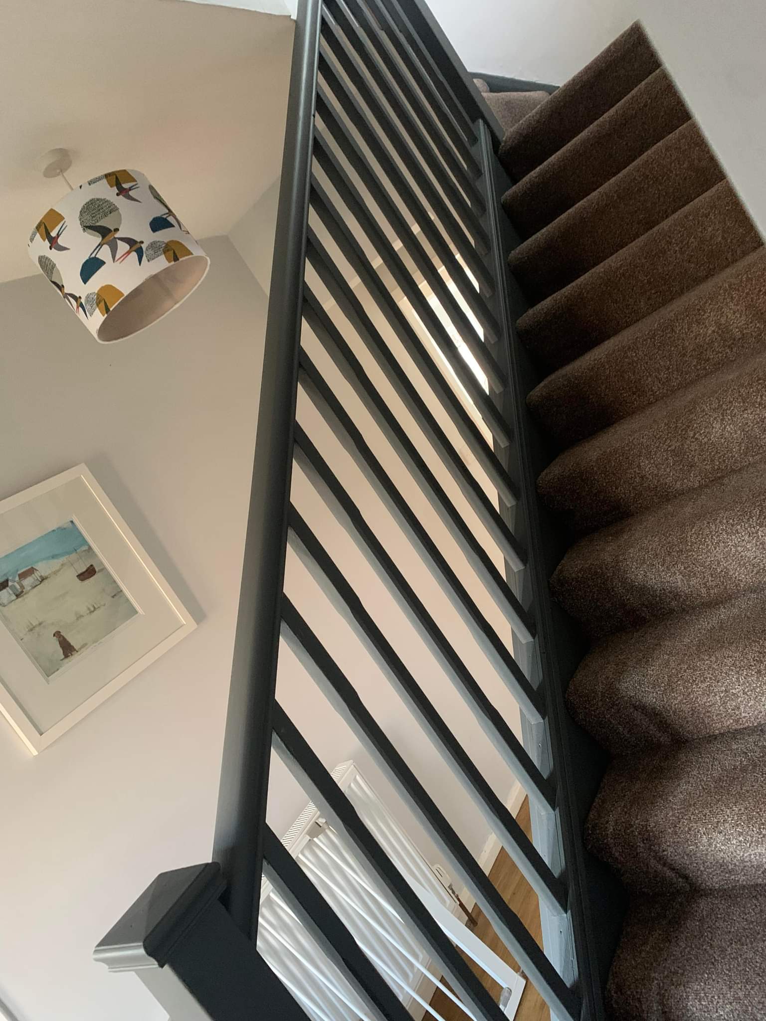 Picture of a staircase painted in dark grey by painters and decorators Leeds