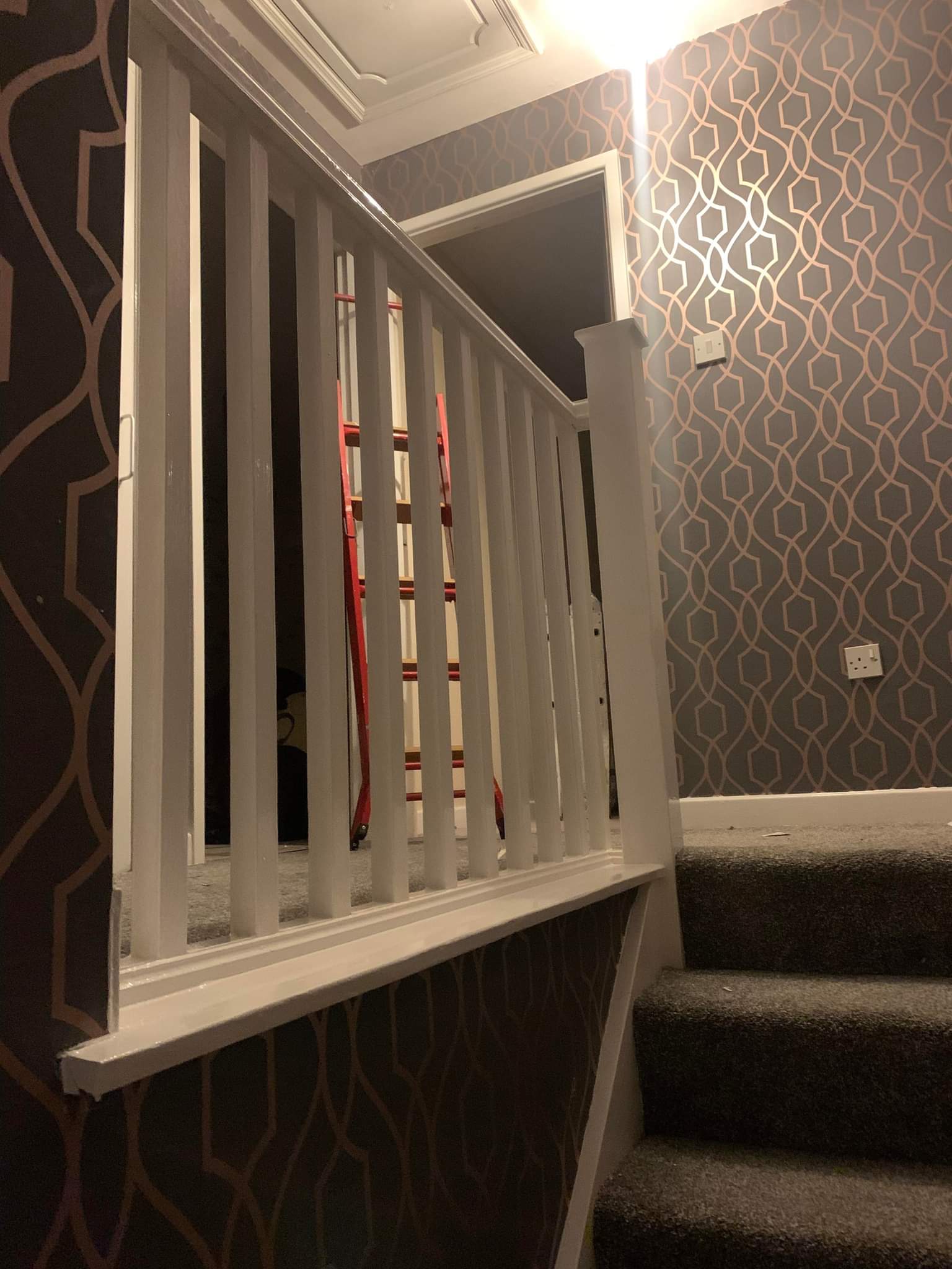 Picture of a landing that has been wallpapered with designer wallpaper by painters and decorators Leeds
