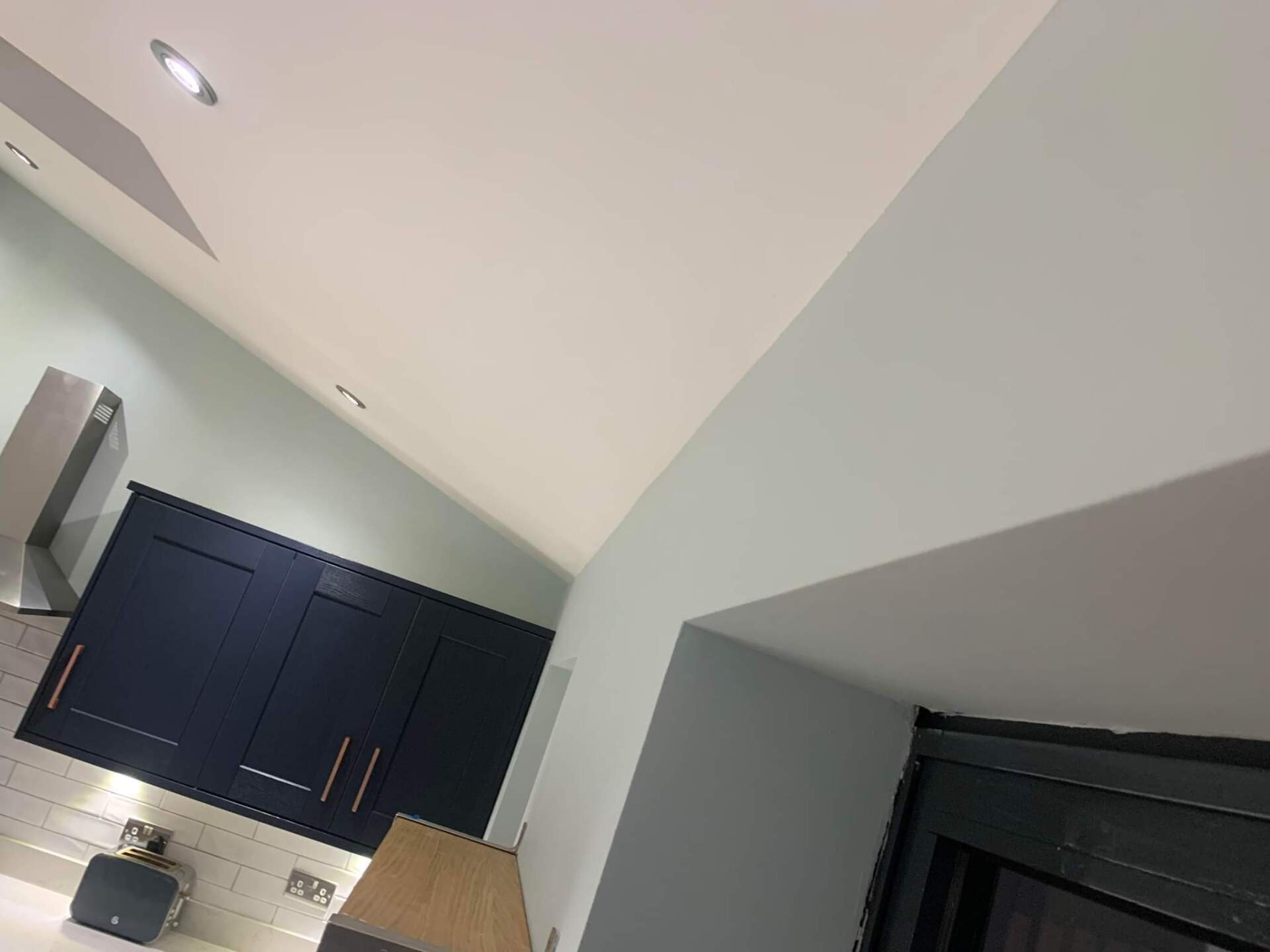 Picture of a newly painted kitchen in light blue by painters and decorators Leeds