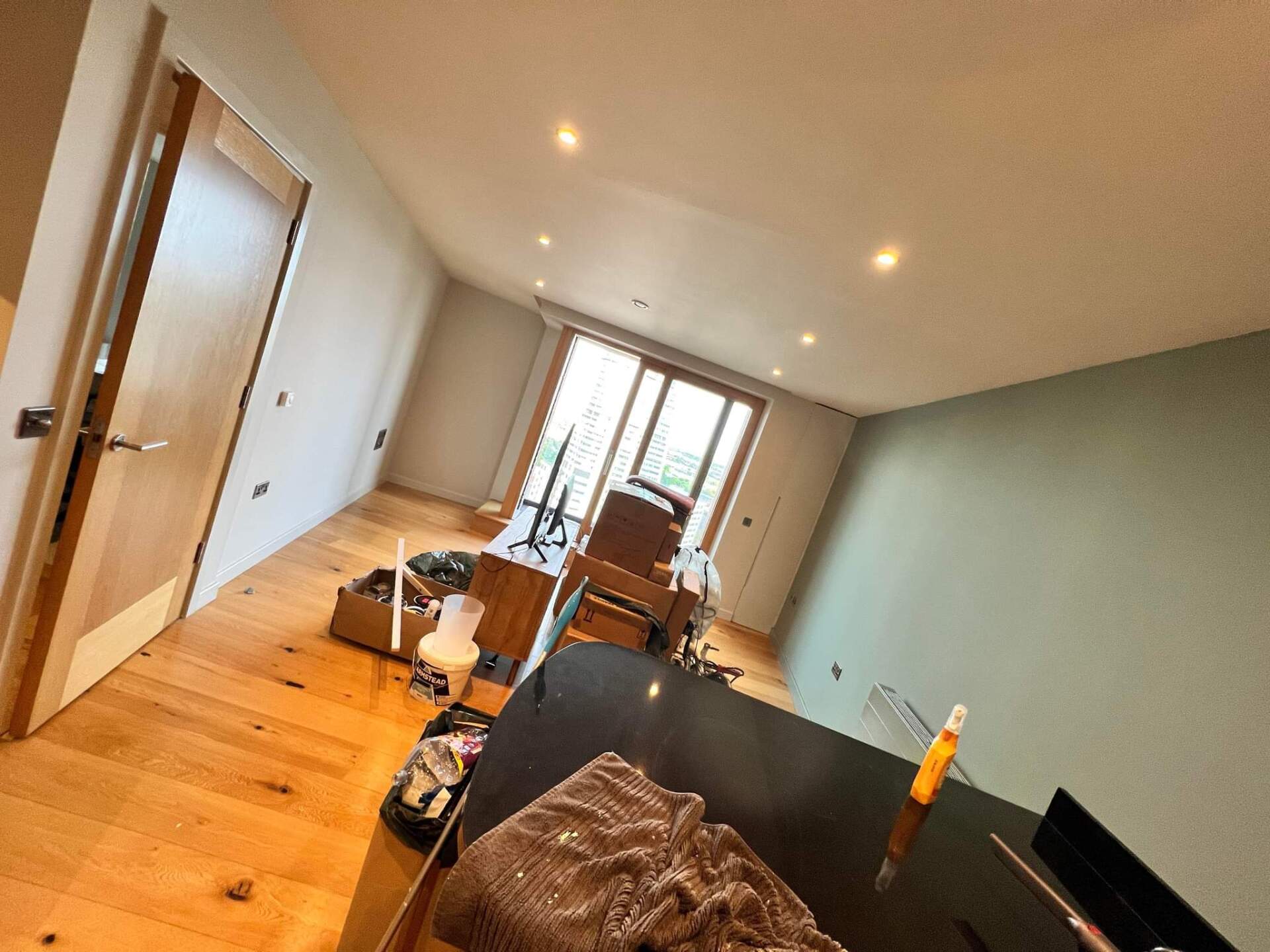 Picture of an apartment lounge painted white by painters and decorators Leeds