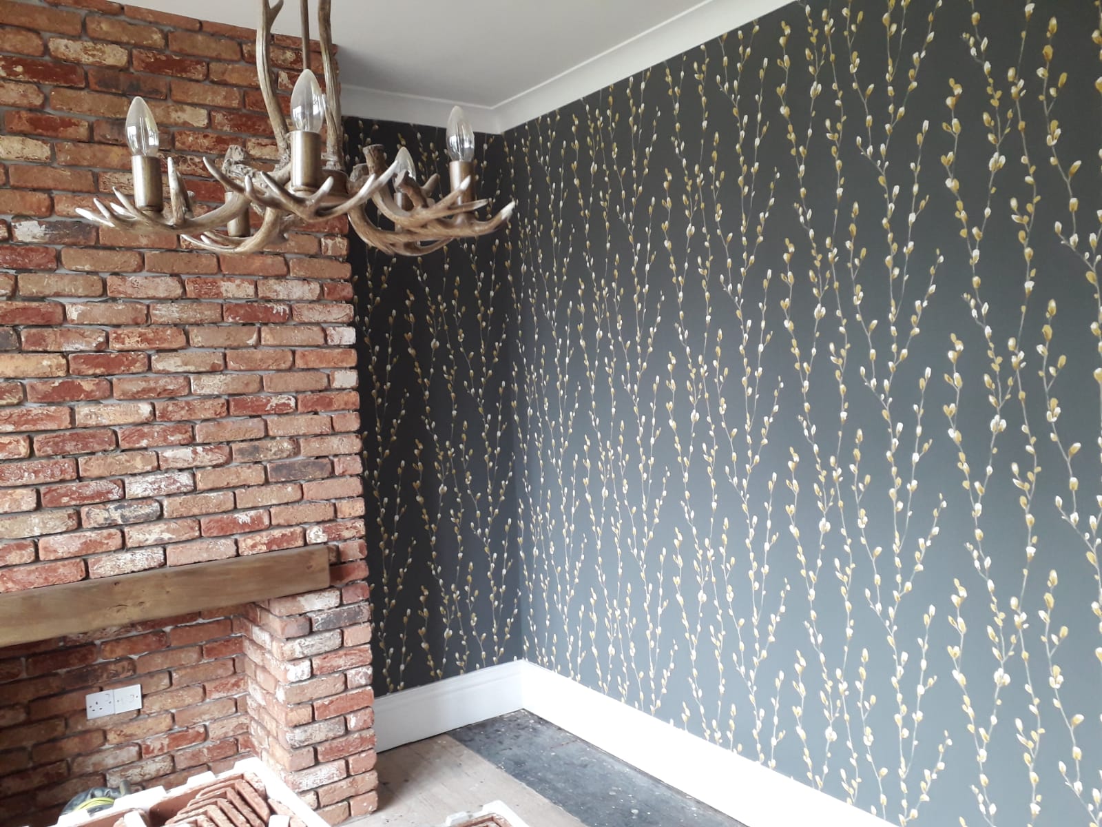 Picture of designer wallpaper hanging on a feature wall carried out by painters and decorators  in Leeds