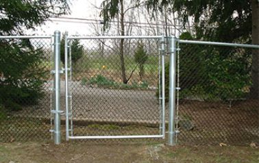A chain link fence with a gate in the middle of it