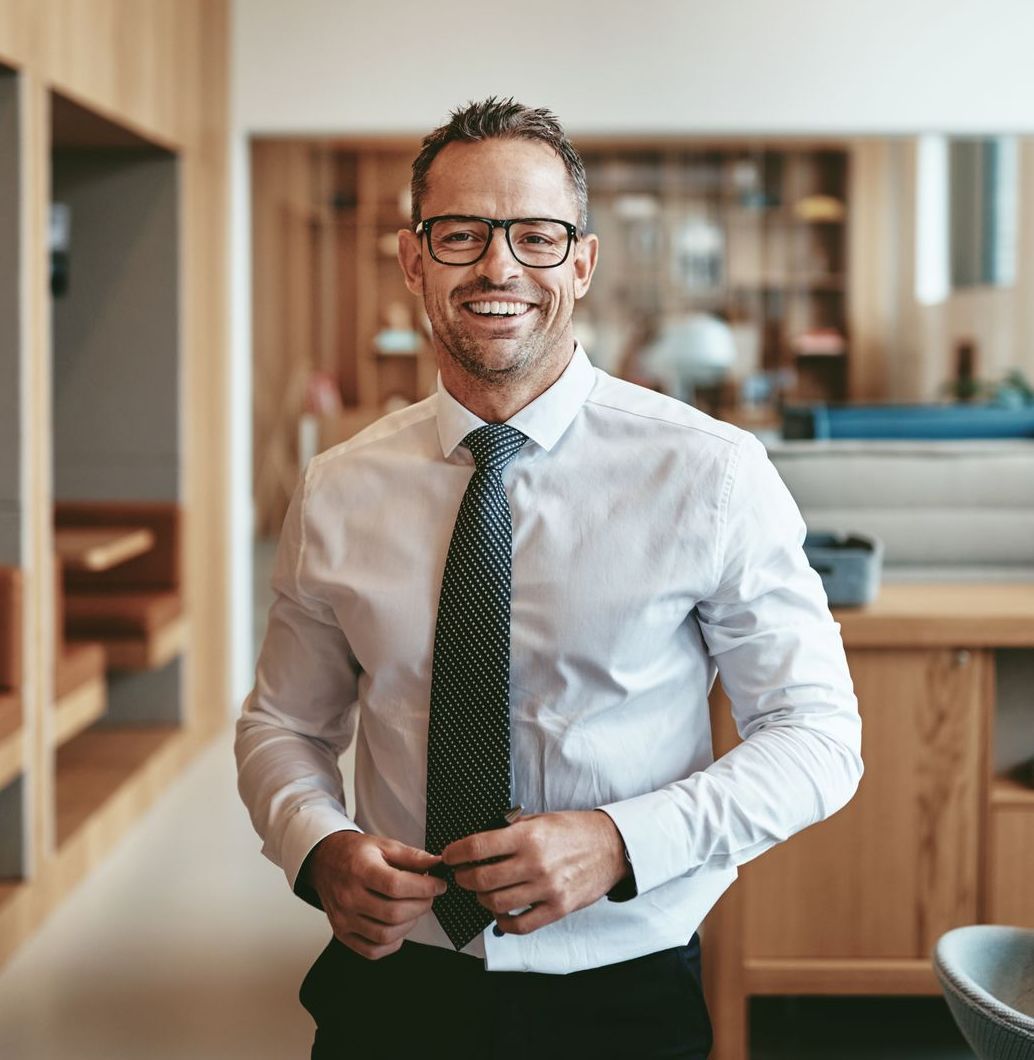 Confident professional standing in a modern workspace