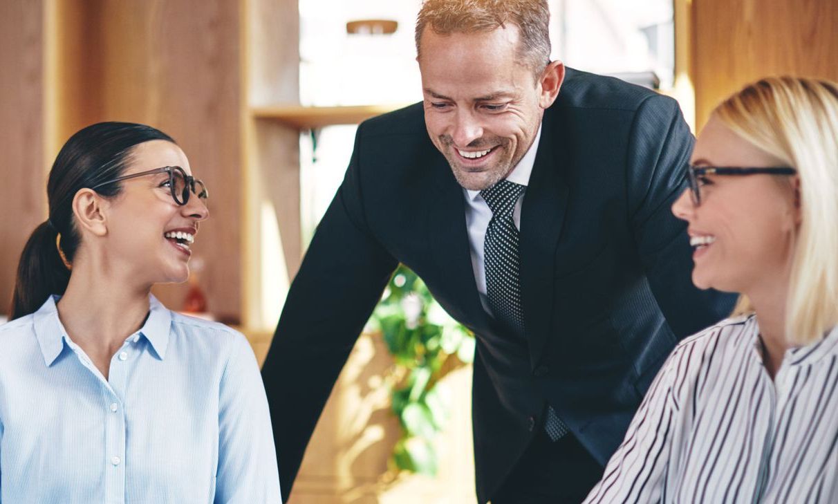Business team collaborating and smiling during a meeting