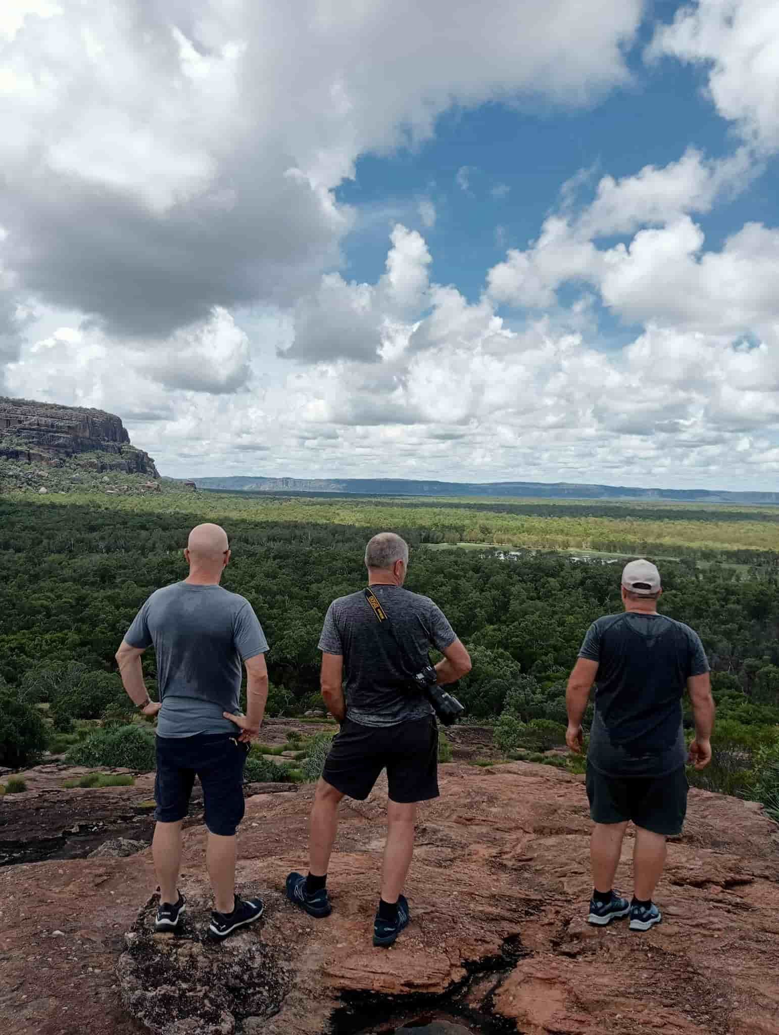 Men Are Standing on a Rocky Hill Overlooking Field  — NT Driver Guide - Escorted Touring & Transfers in Darwin City, NT