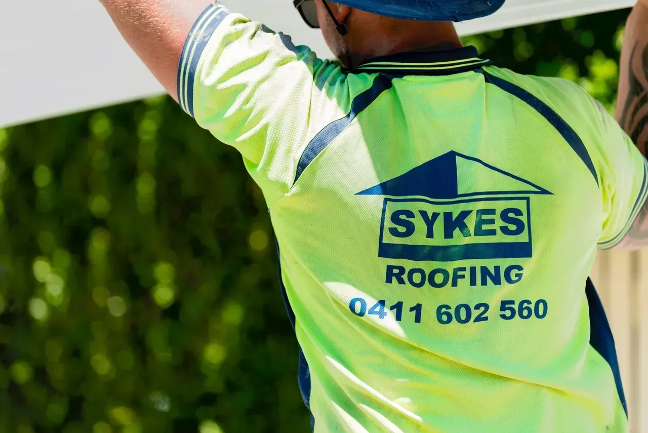 Man using green uniform | Brisbane, QLD | Skyes Roofing