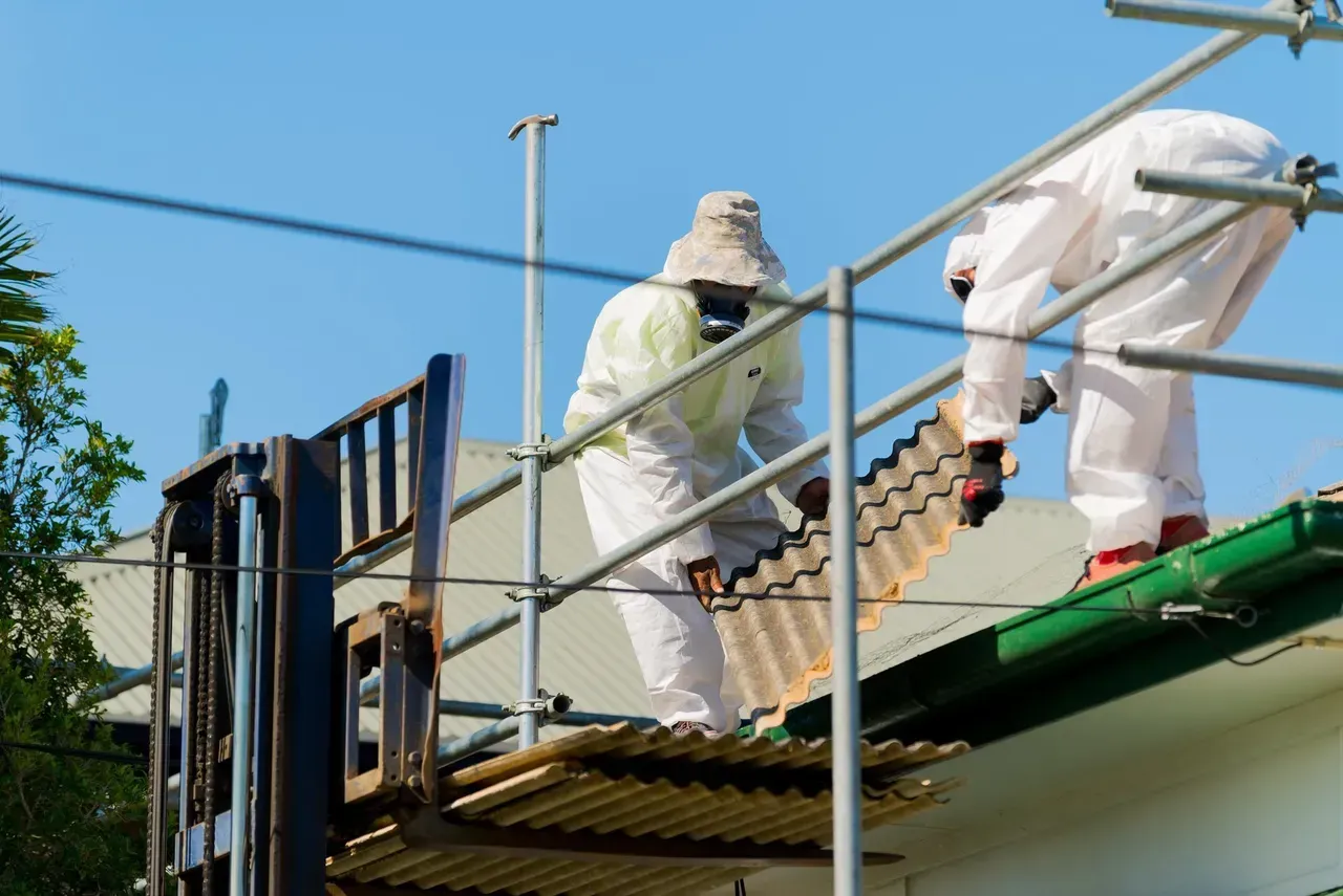 Men holding roof tile | Brisbane, QLD | Skyes Roofing