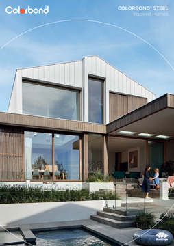 Modern house with light-colored panels, large windows, and a family on the patio. Pool and blue sky visible.