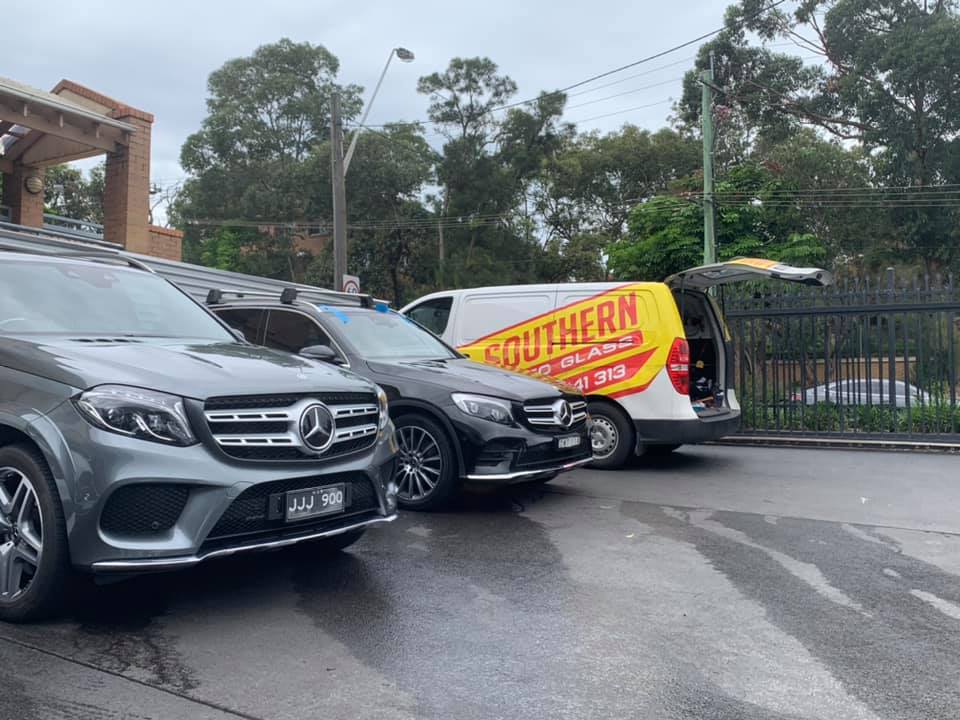 Southern Auto Glass mobile service vehicle beside an SUV