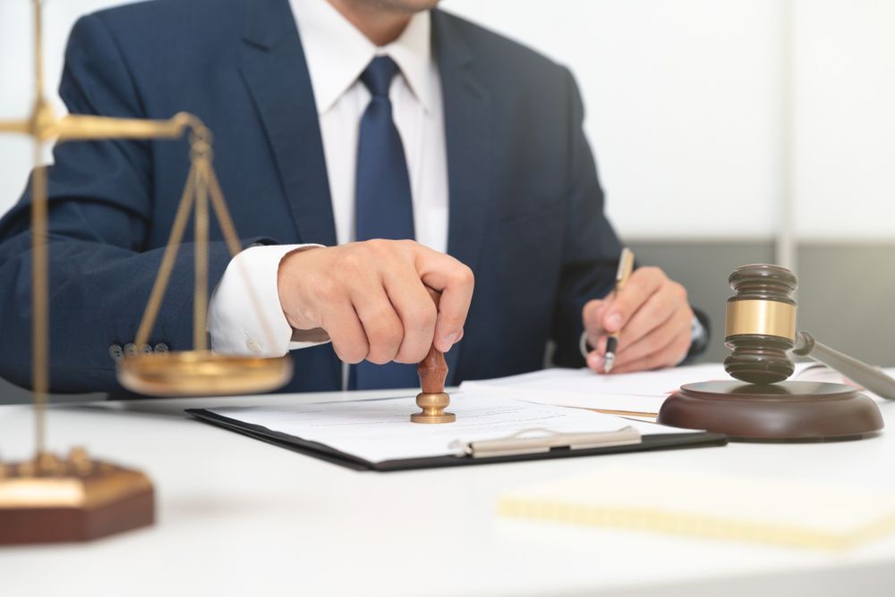 Attorney Working With Papers in Office