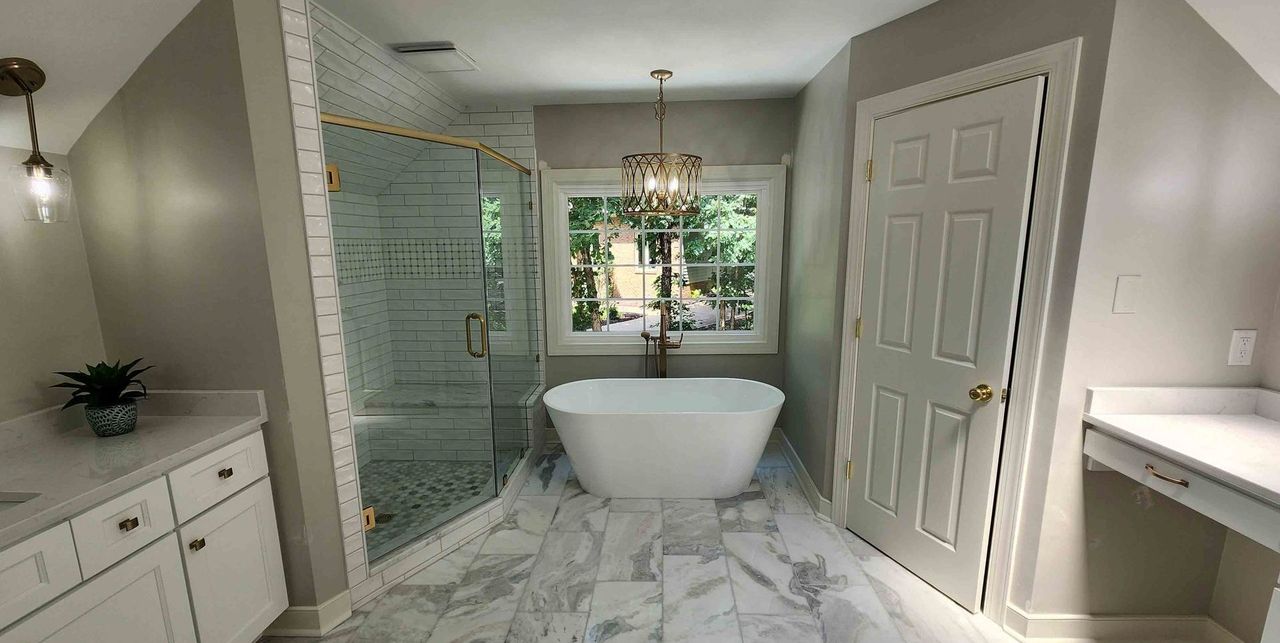 There is a bathtub in the middle of the bathroom.