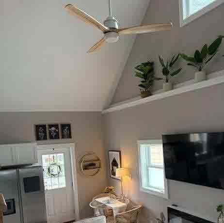 A kitchen with stainless steel appliances and white cabinets.