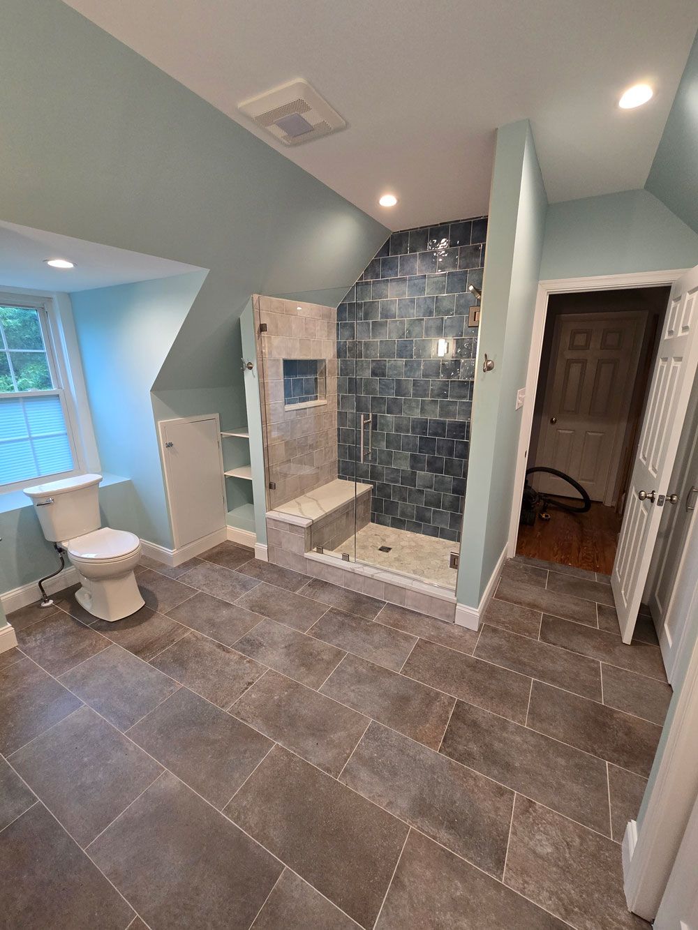 There is a bathtub in the middle of the bathroom.