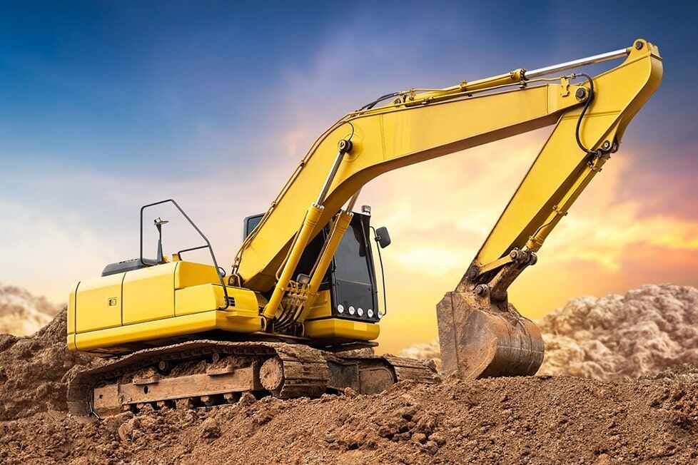 A Yellow Excavator Is Digging A Hole In The Dirt — Kset Engineering in Thornton, NSW