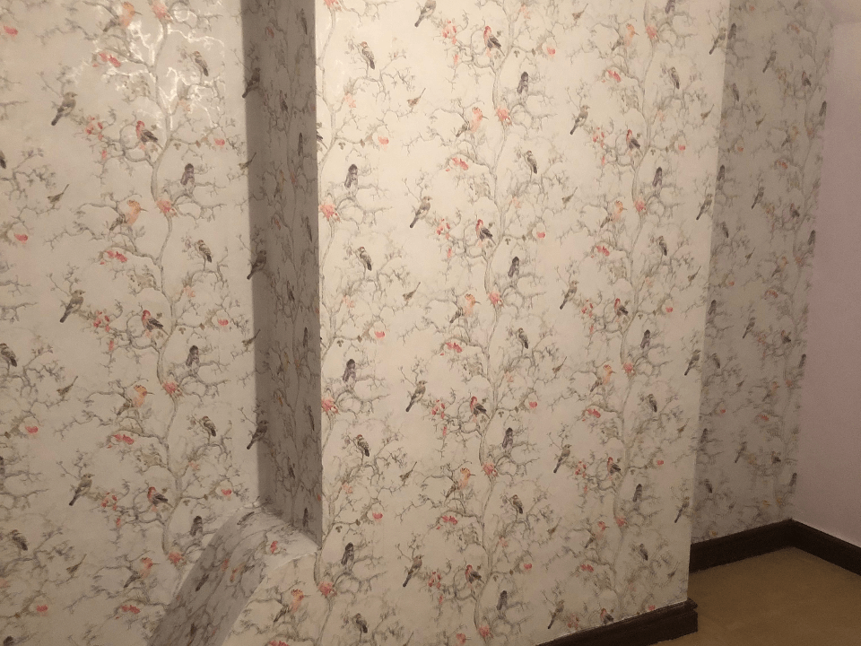 Picture of designer wallpaper hanging on a feature wall carried out by painters and decorators Birmingham