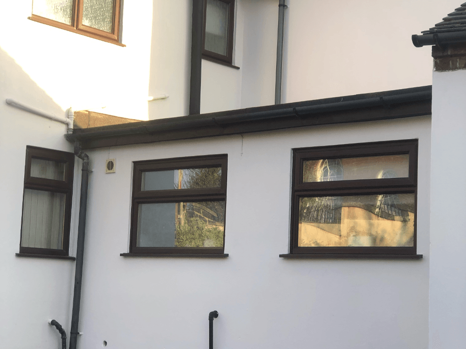 Picture of a rendered house and off shot newly painted in white by Painters and Decorators Leeds.