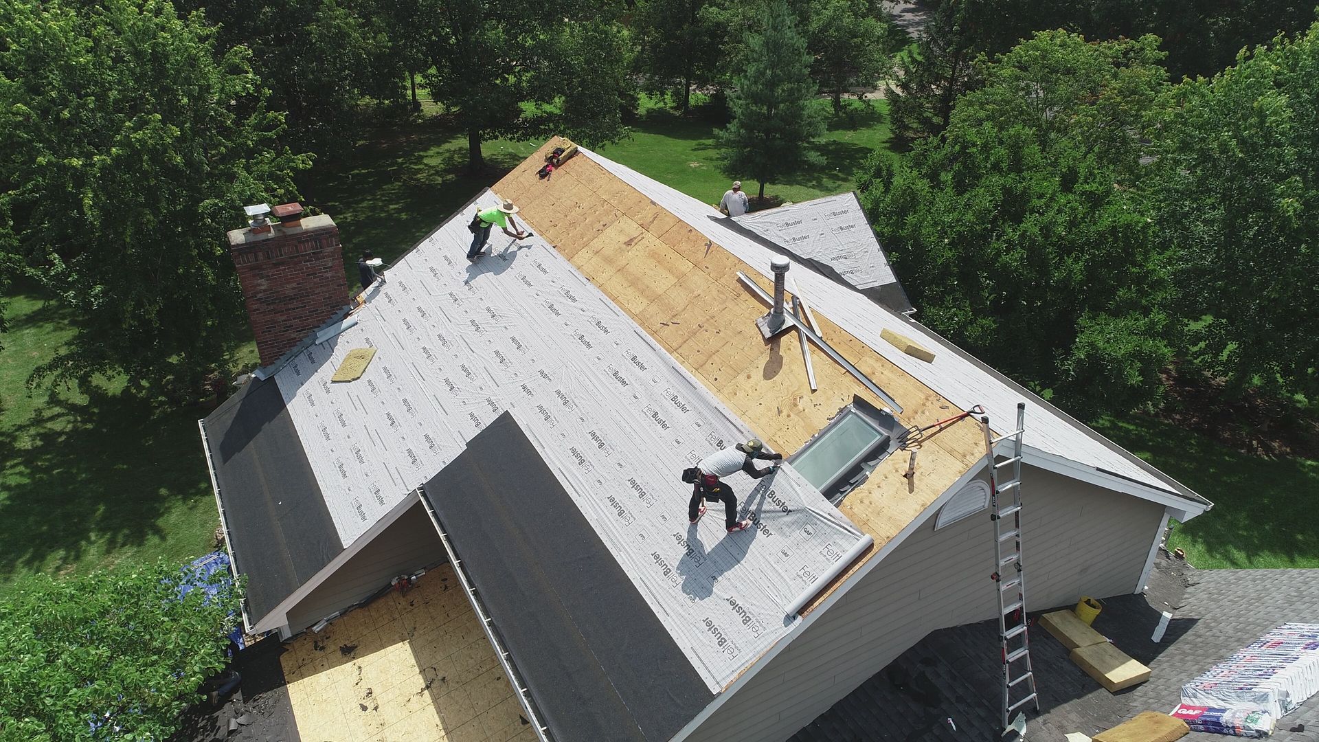 Licensed roofer inspecting a residential roof
