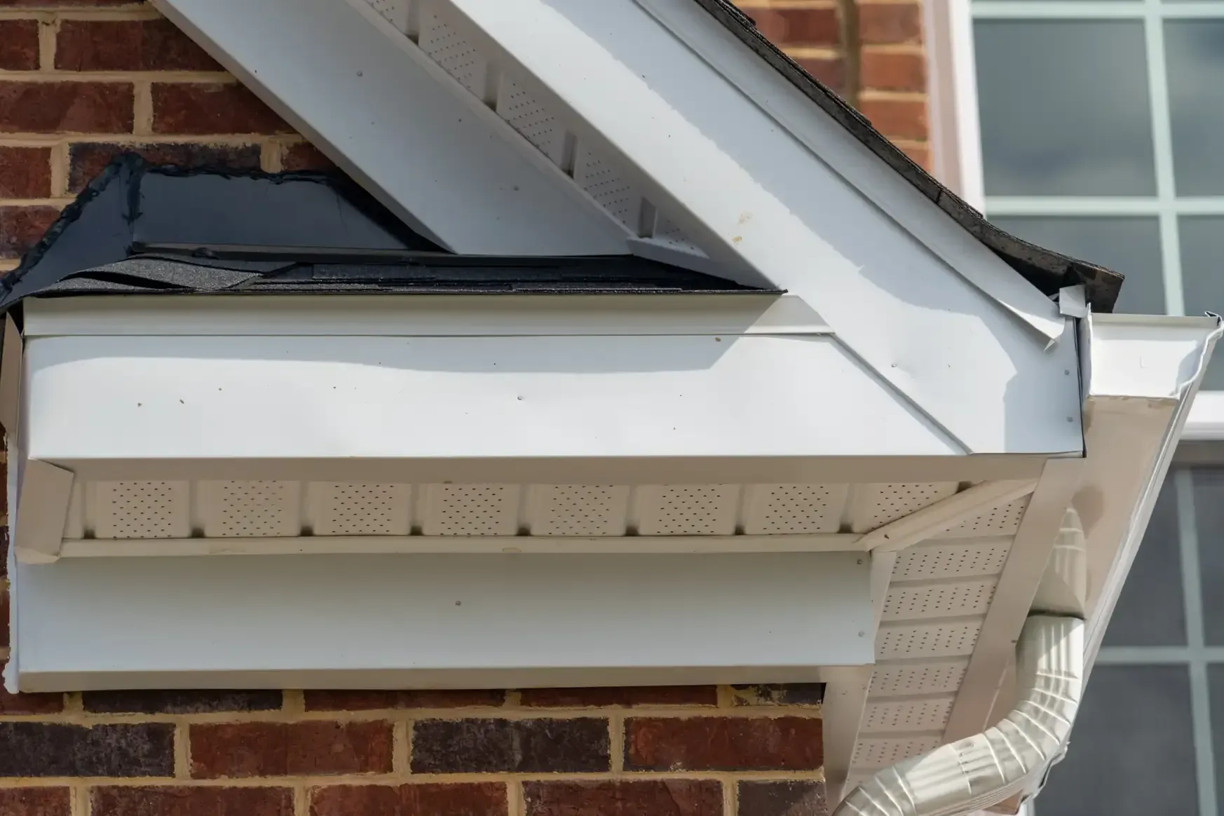 White roof drip edge and drip edge flashing on house gutter system