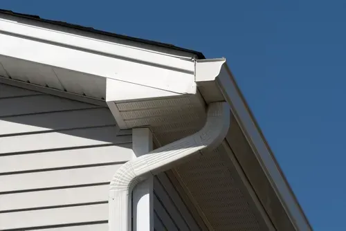 rain gutter of roof metal pipe white facade