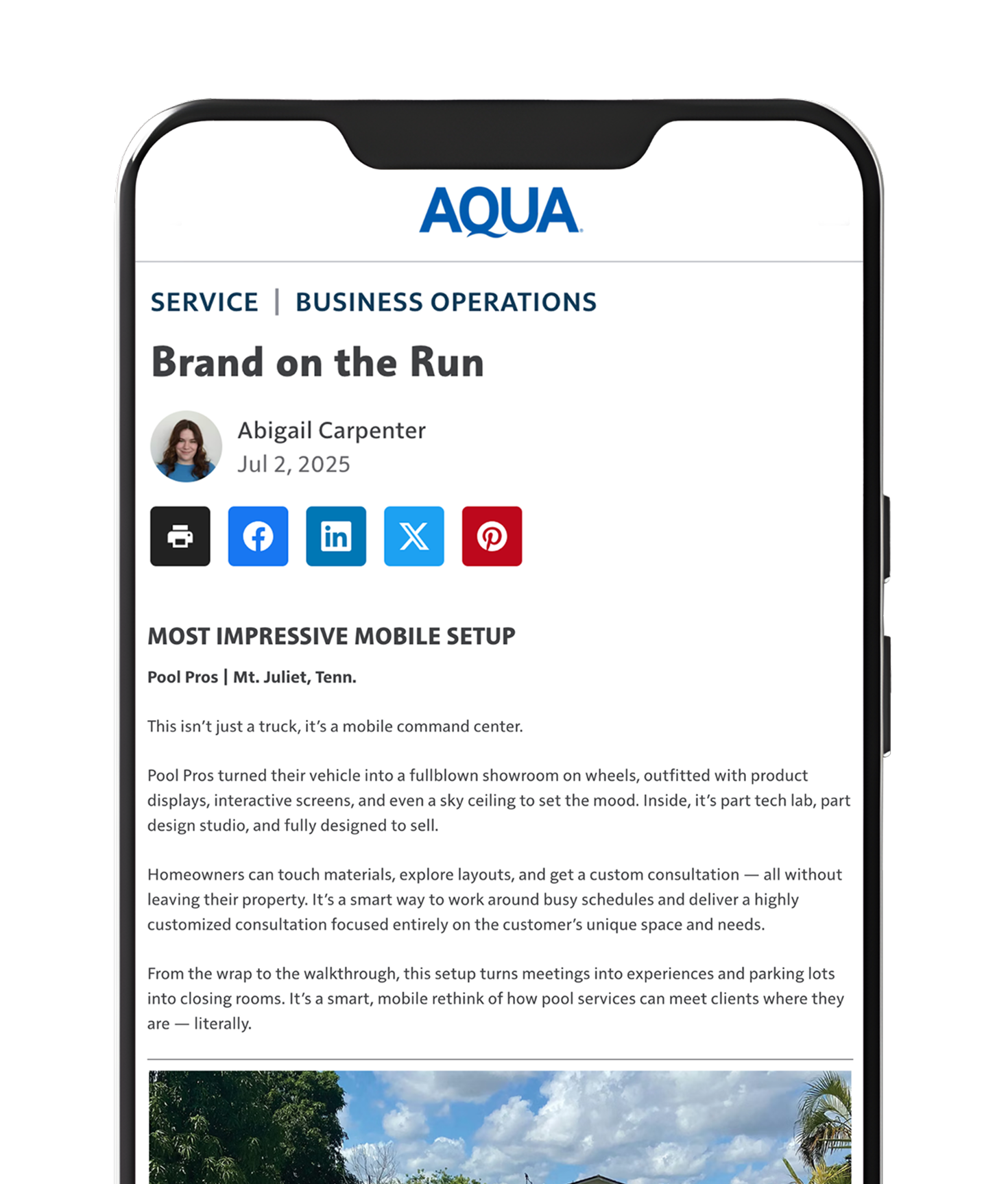 Rectangular pool with turquoise water, surrounded by wooden decking and three striped lounge chairs.