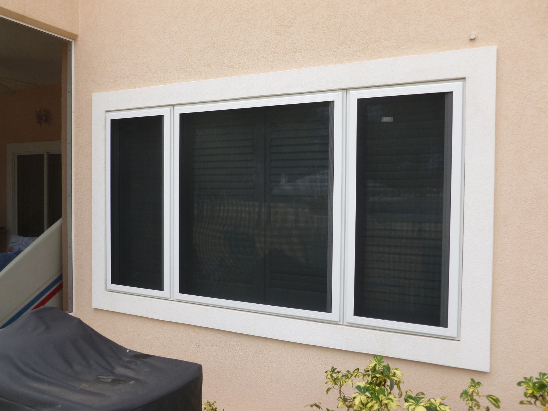 A large window on the side of a house