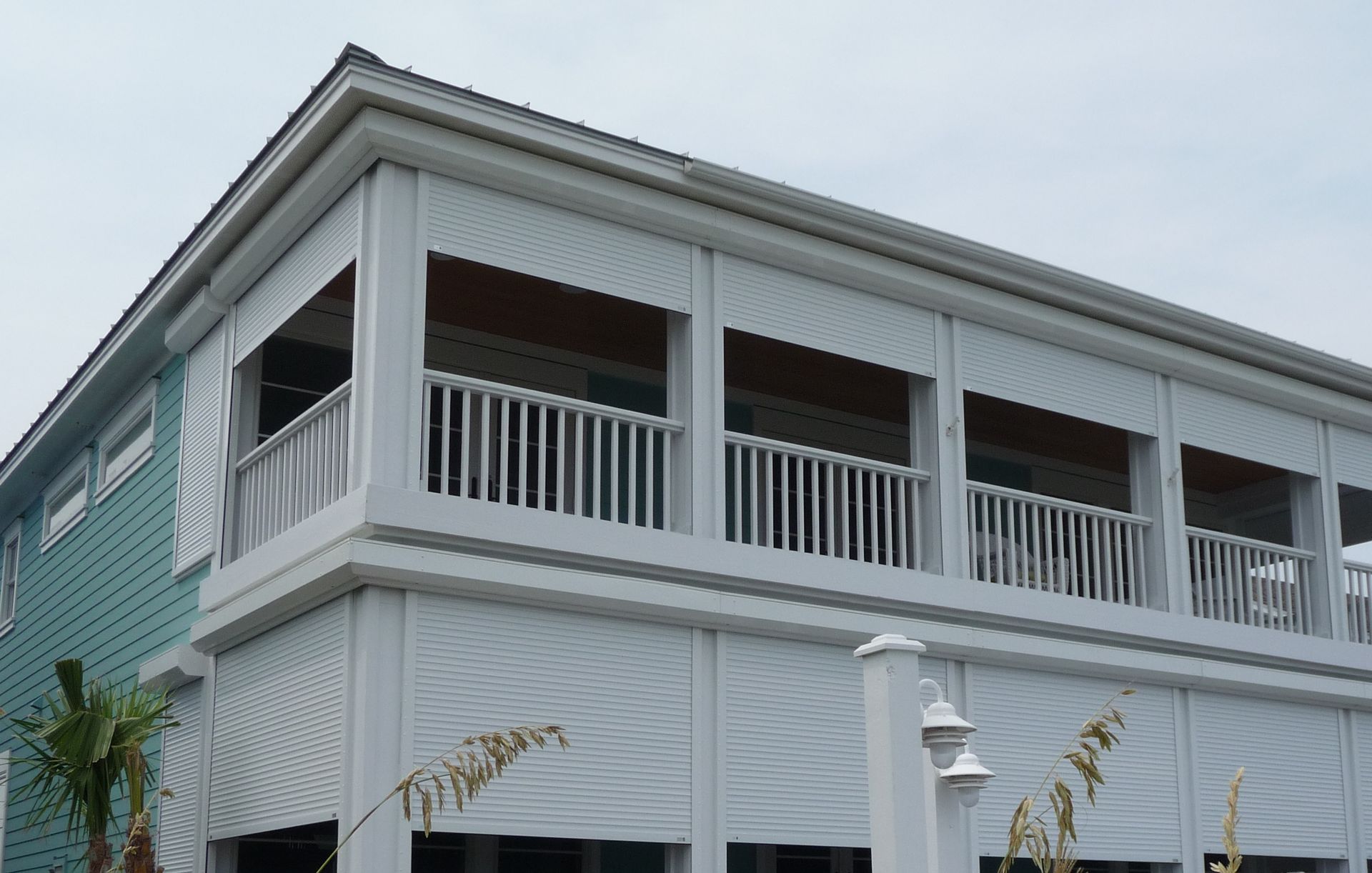 A large white house with a lot of windows and balconies