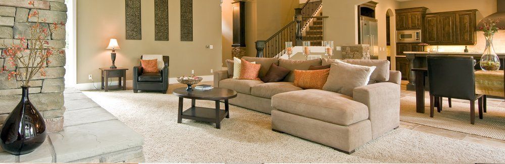 A living room filled with furniture and a fireplace