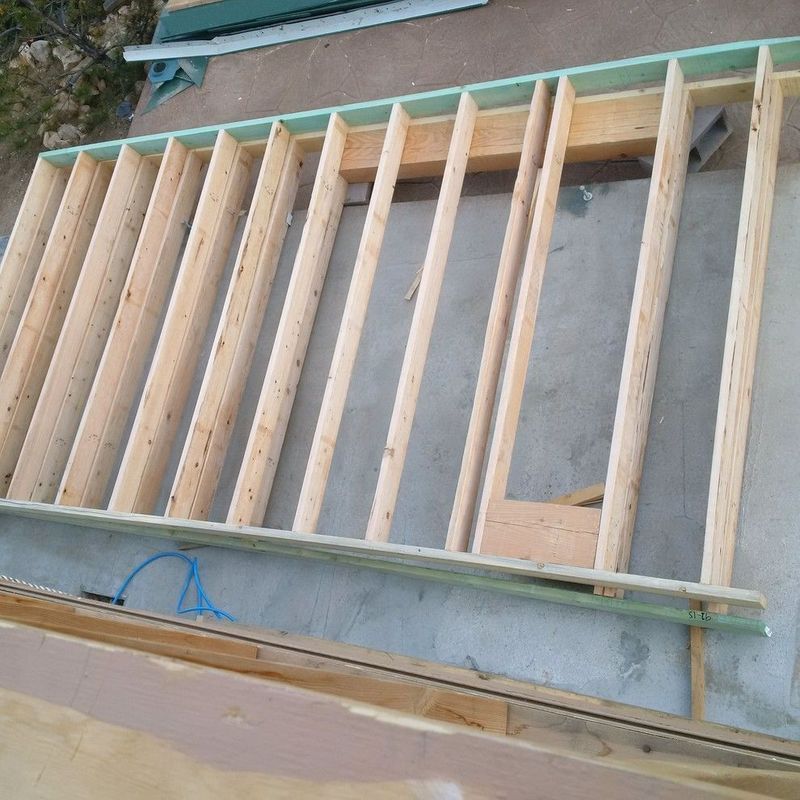 A wooden frame is sitting on a concrete surface