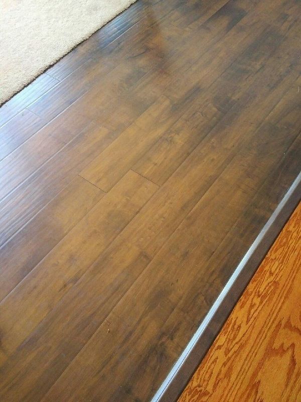 A close up of a wooden floor in a living room