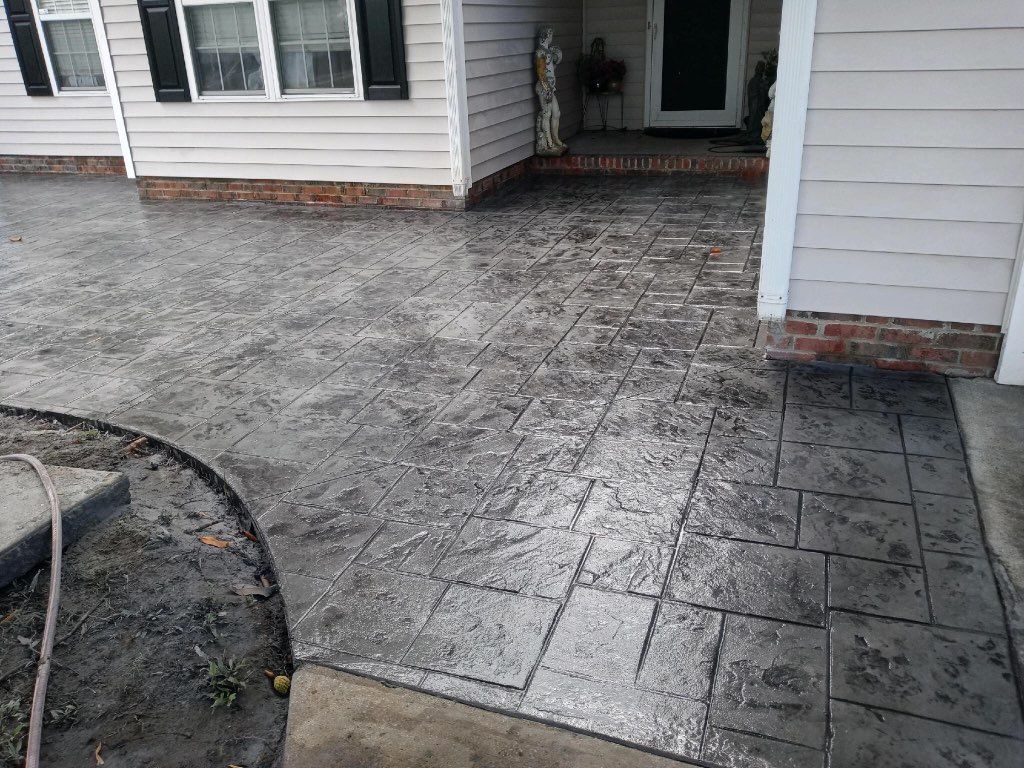 Concrete Solutions of Wilmington LLC Stamped Concrete Patio with decorative coloring