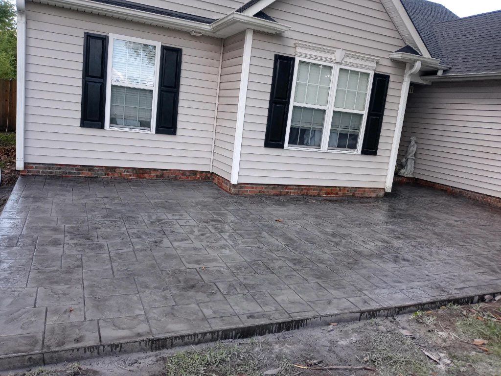 Concrete Solutions of Wilmington LLC Stamped Concrete Patio with decorative coloring