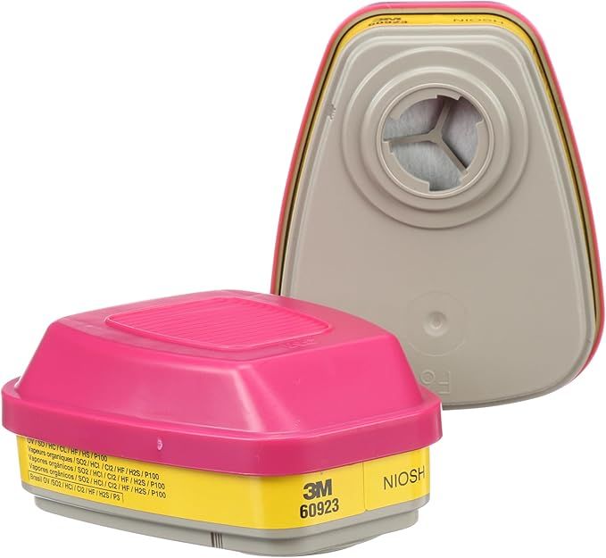 A pink and yellow 3m filter is sitting on a white surface