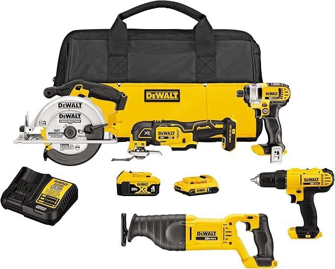 A dewalt tool set with a circular saw , drill , and reciprocating saw.