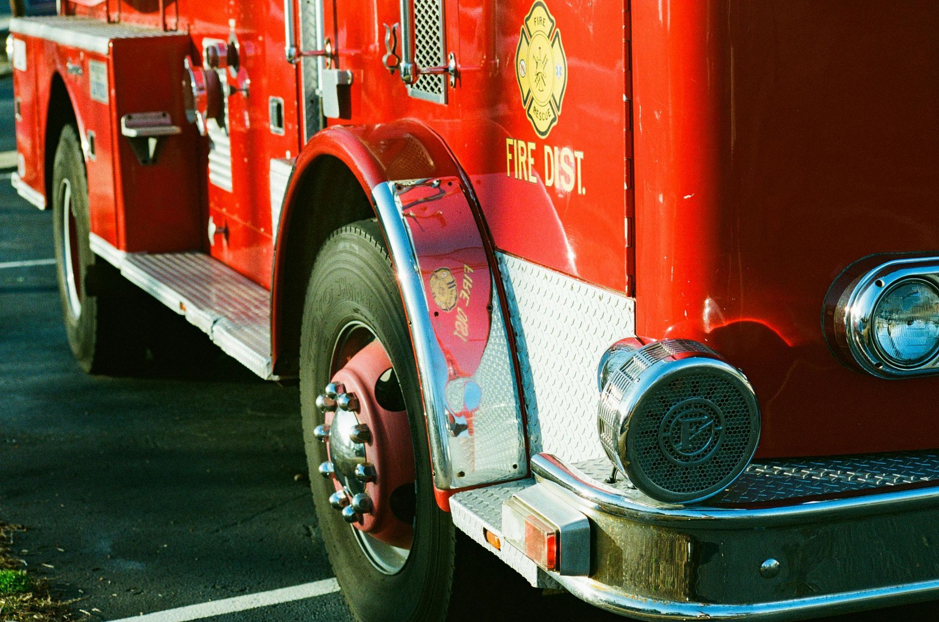 A red fire truck is parked in a parking lot